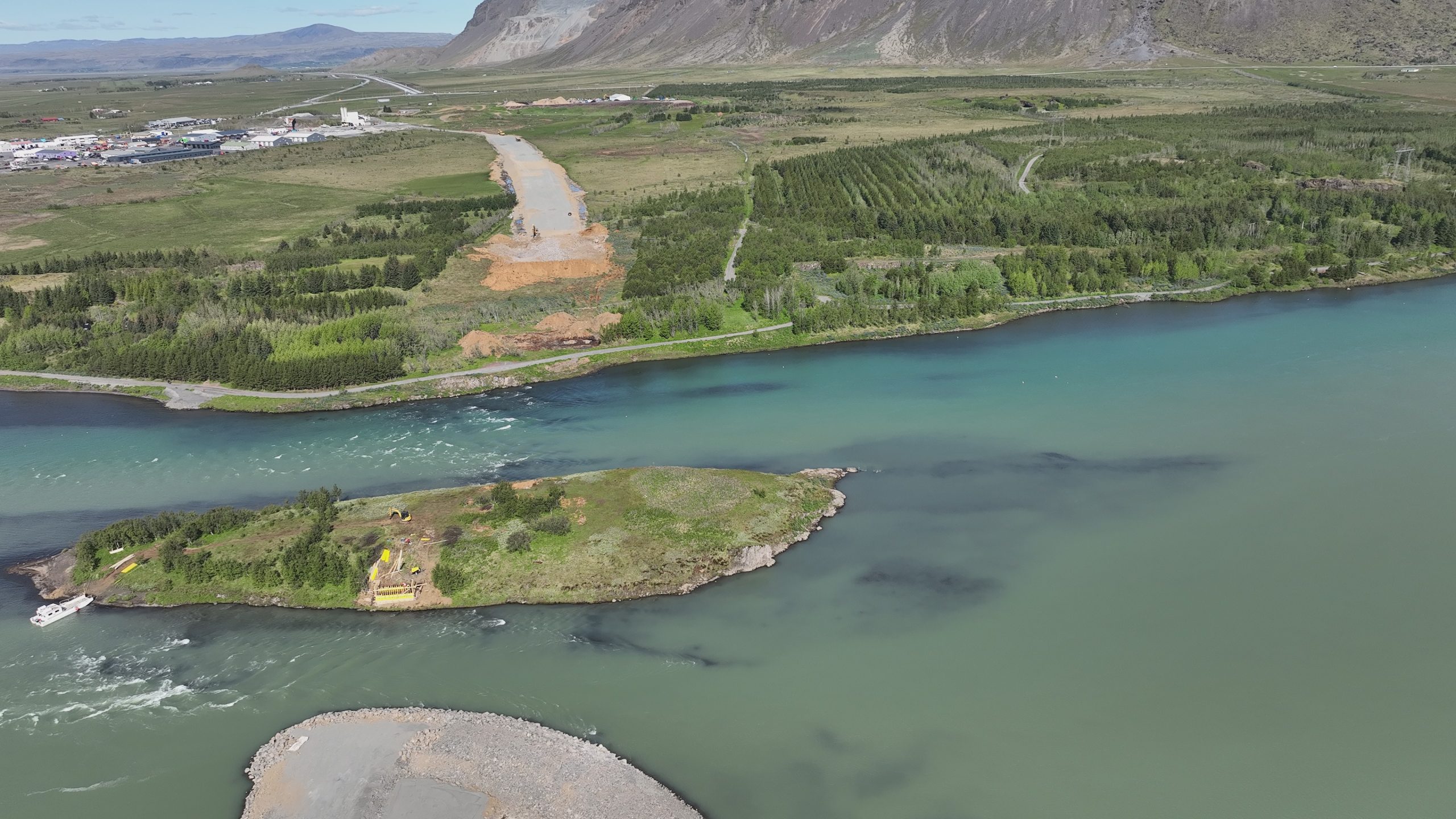 Aerial view of the construction area. River defences protecting from the powerful Ölfusá have been constructed on the eastern riverbank.