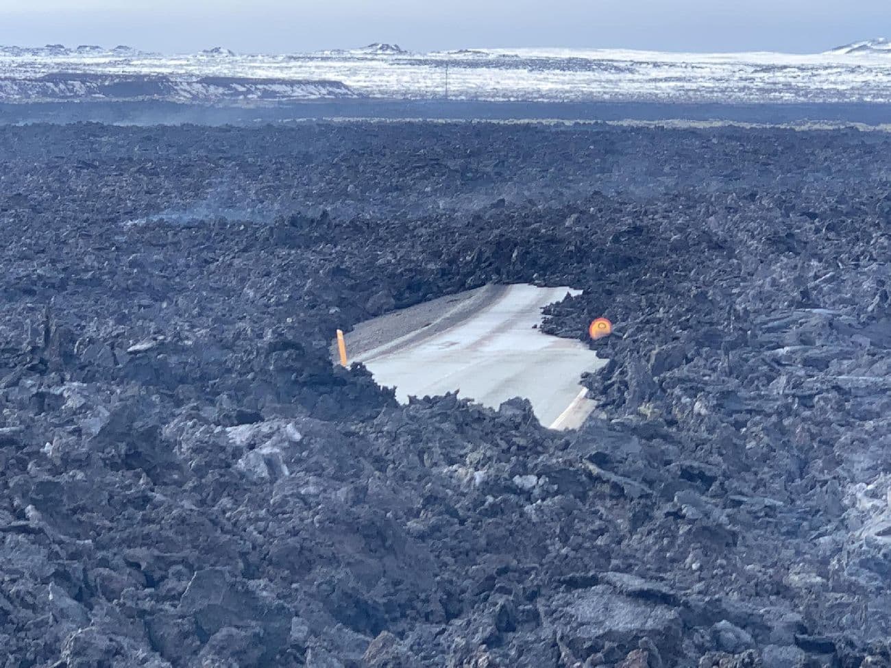 The old road to Grindavík (43) under fresh lava.